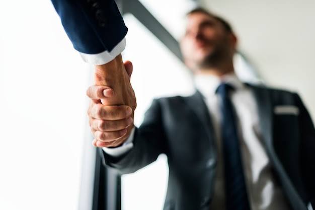 A handshake between advisors, representing trust and continuity