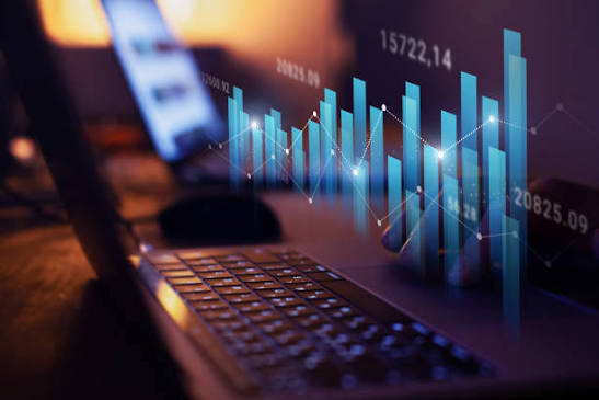 Financial performance chart projected above a desk