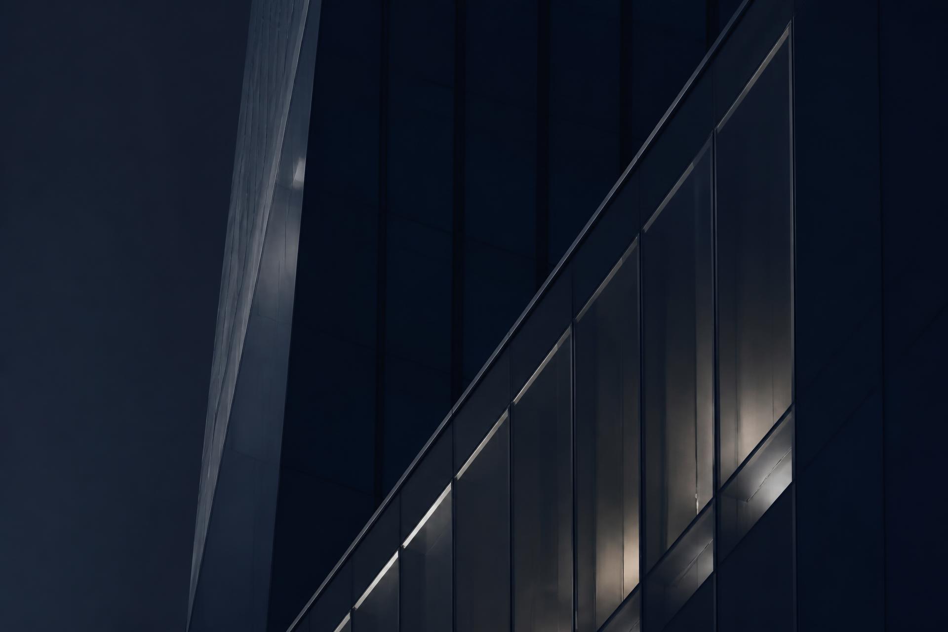 Glass facade of a modern tower at dusk